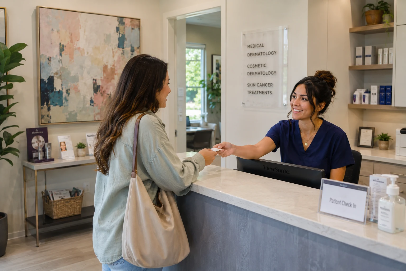 A patient checking in with a smiling front desk receptionist